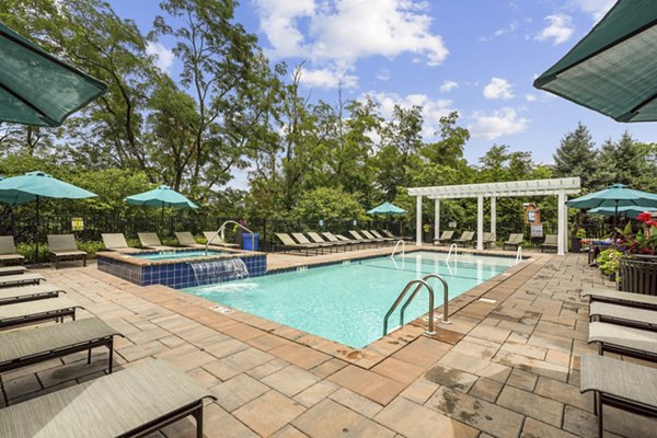 Sparkling outdoor pool at Liberty Bay Club Apartments, perfect for relaxation and recreation in this luxury community