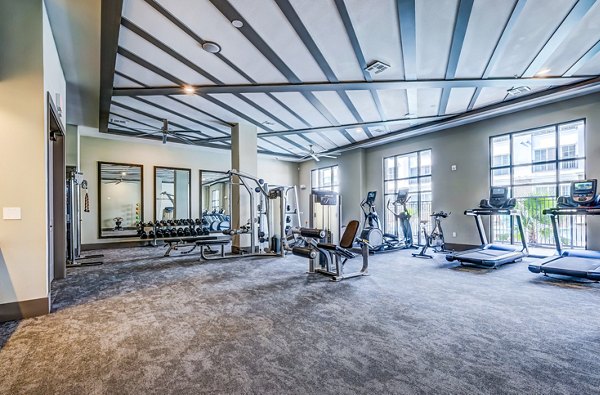 Modern fitness center with cardio and strength equipment at Shoreview Flats Apartments offering a luxury workout experience