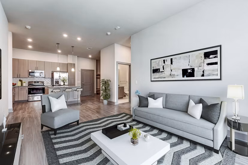 Modern living room with city views at Shoreview Flats Apartments