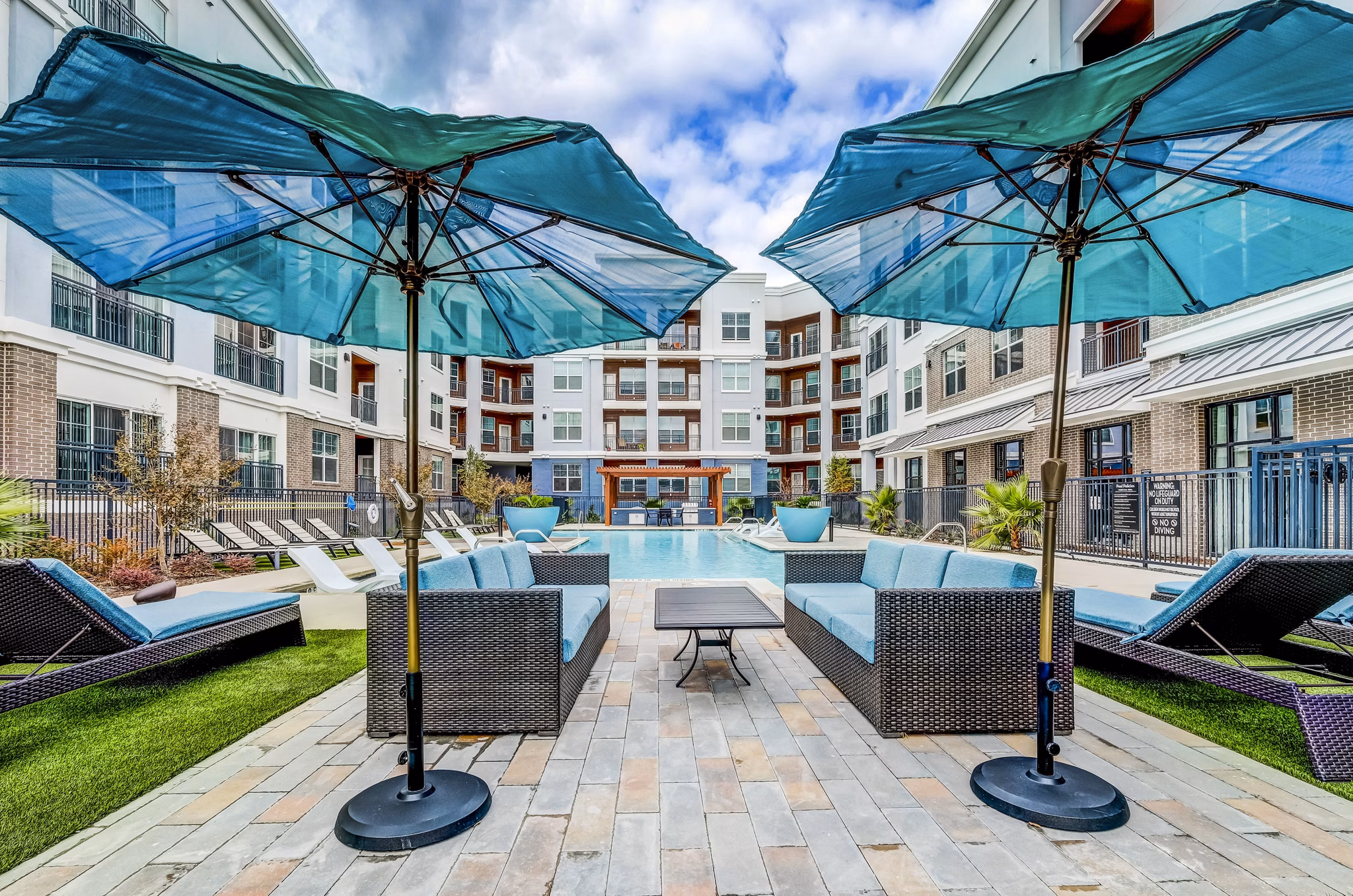 Luxurious outdoor pool with lounge chairs at Shoreview Flats Apartments offering relaxation and leisure amenities for residents