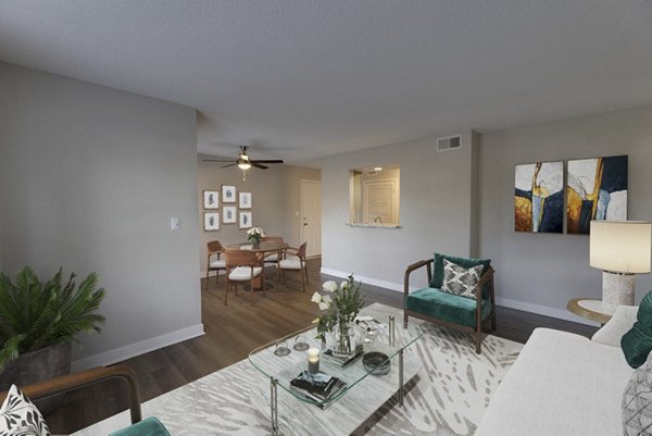 Spacious living room with modern decor at Wellington Apartments, featuring plush seating and large windows