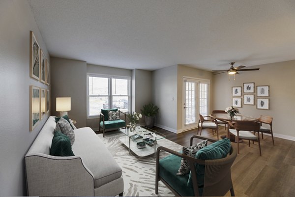 Living room featuring contemporary furniture and natural lighting at Wellington Apartments