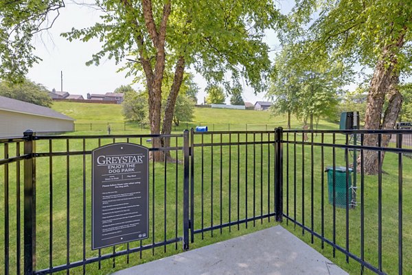 Dog park with agility course at Wellington Apartments, perfect for pet owners in luxury living environments