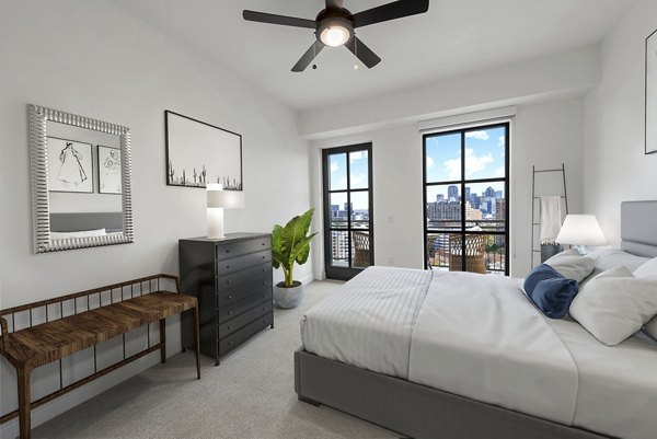 Cozy bedroom with modern furnishings at Novel Turtle Creek Apartments