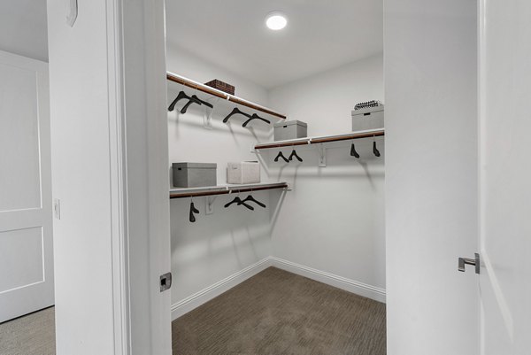 Spacious closet with custom shelving in Novel Turtle Creek Apartments