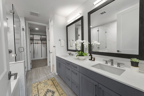 Contemporary bathroom with elegant fixtures at Novel Turtle Creek Apartments