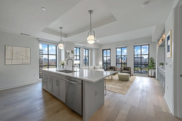 Modern kitchen with sleek cabinetry and stainless steel appliances at Novel Turtle Creek Apartments