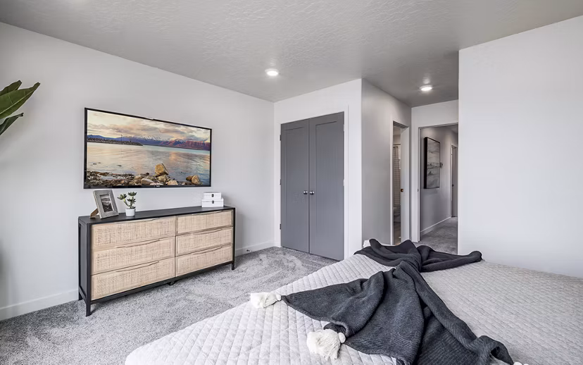 Cozy bedroom with modern decor at Banner Hill Apartments, offering luxury living in an urban setting
