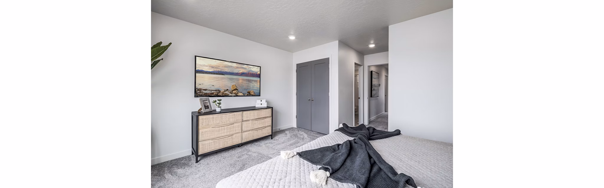Cozy bedroom with modern decor at Banner Hill Apartments, offering luxury living in an urban setting