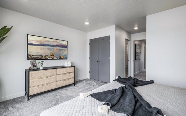 Cozy bedroom with modern decor at Banner Hill Apartments, offering luxury living in an urban setting