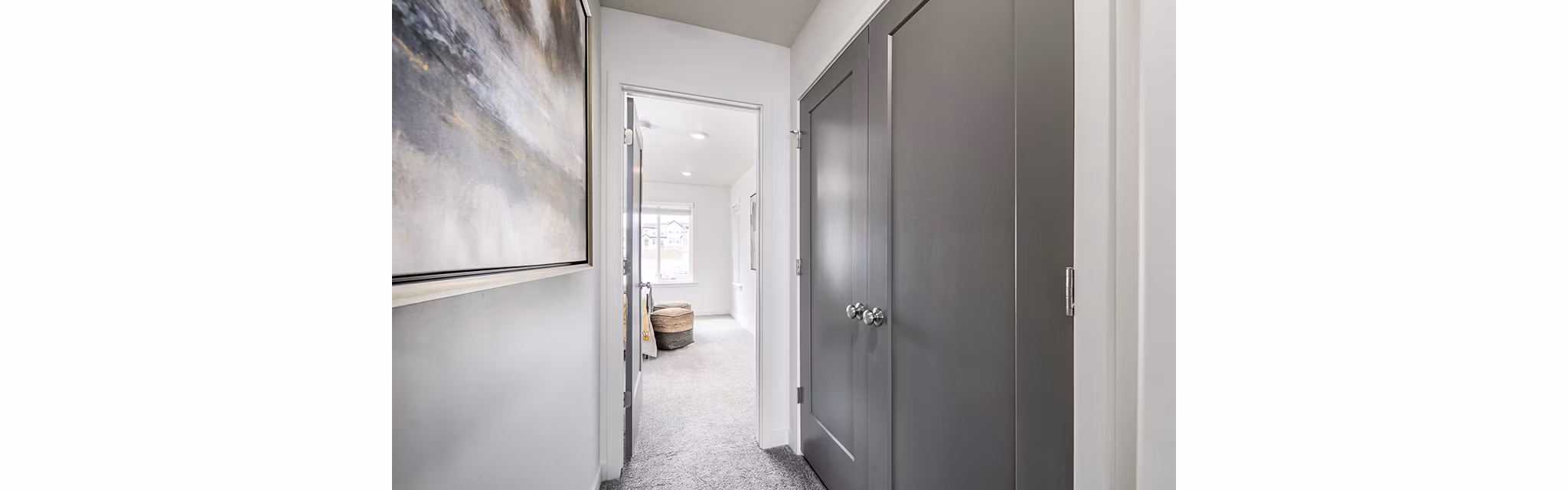 Contemporary hallway with modern lighting at Banner Hill Apartments, showcasing sleek design in a luxury apartment community