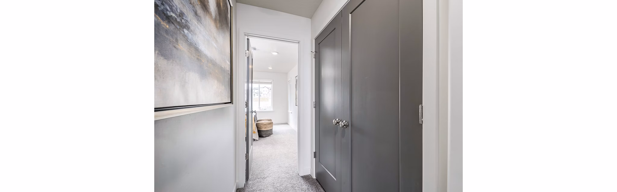 Contemporary hallway with modern lighting at Banner Hill Apartments, showcasing sleek design in a luxury apartment community