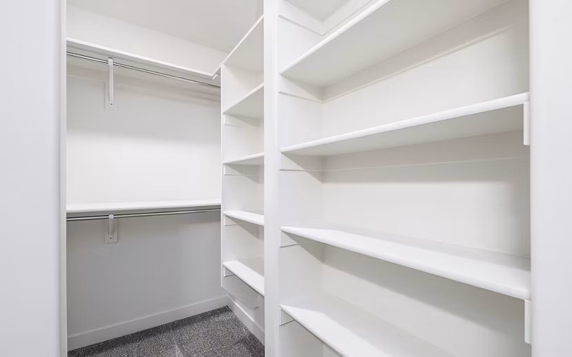 Cozy bedroom with modern decor at Banner Hill Apartments, offering luxury living in Baltimore
