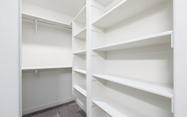 Cozy bedroom with modern decor at Banner Hill Apartments, offering luxury living in Baltimore