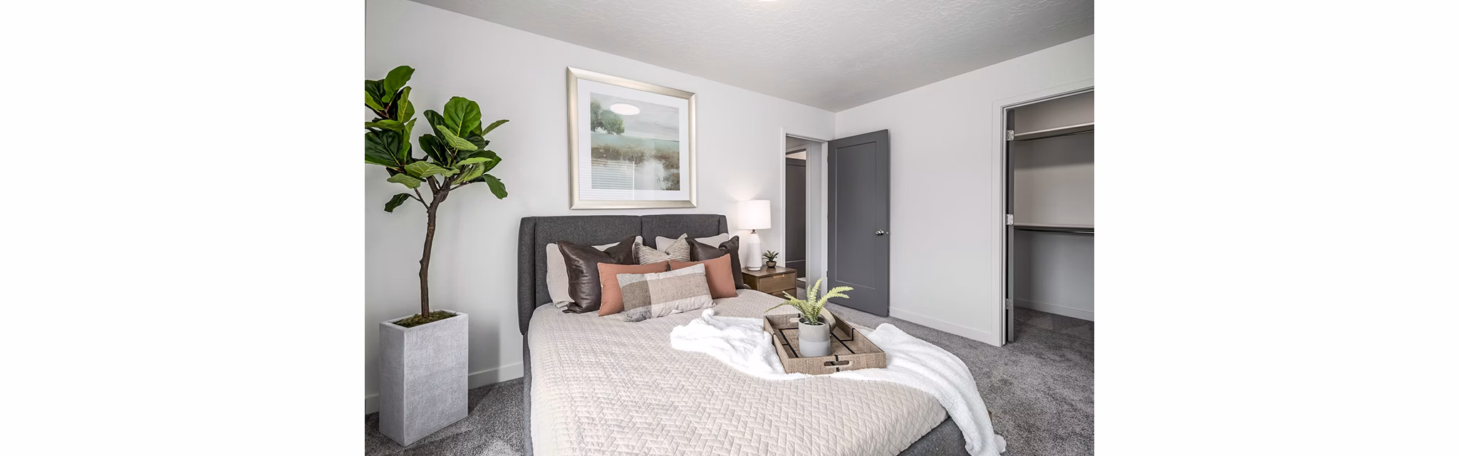 Stylish bedroom with modern furnishings at Banner Hill Apartments, offering a luxurious living experience in the city