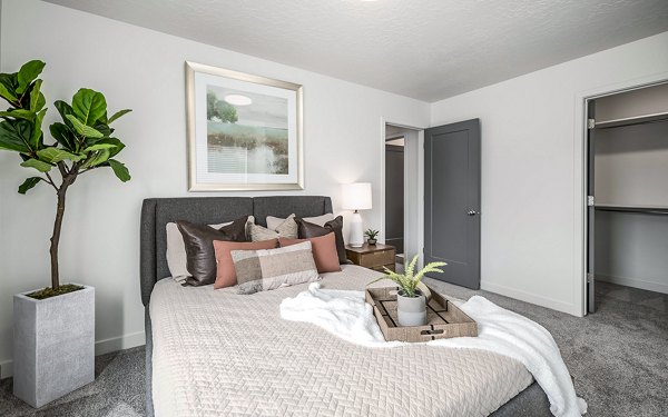 Stylish bedroom with modern furnishings at Banner Hill Apartments, offering a luxurious living experience in the city