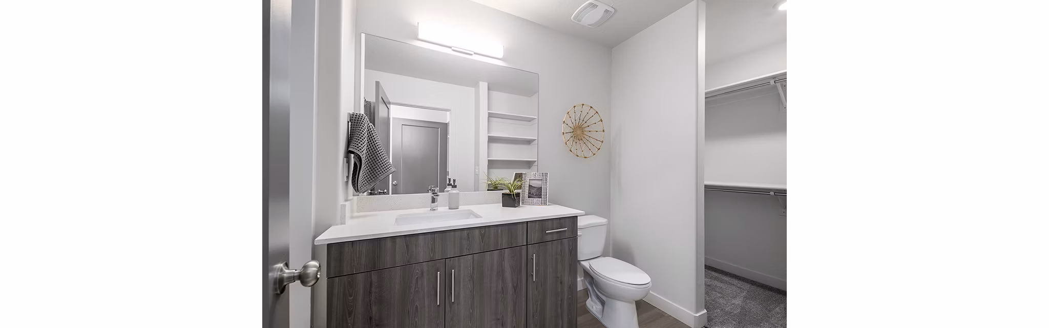 Bathroom with sleek fixtures and elegant lighting at Banner Hill Apartments in Baltimore, offering luxurious and modern living spaces