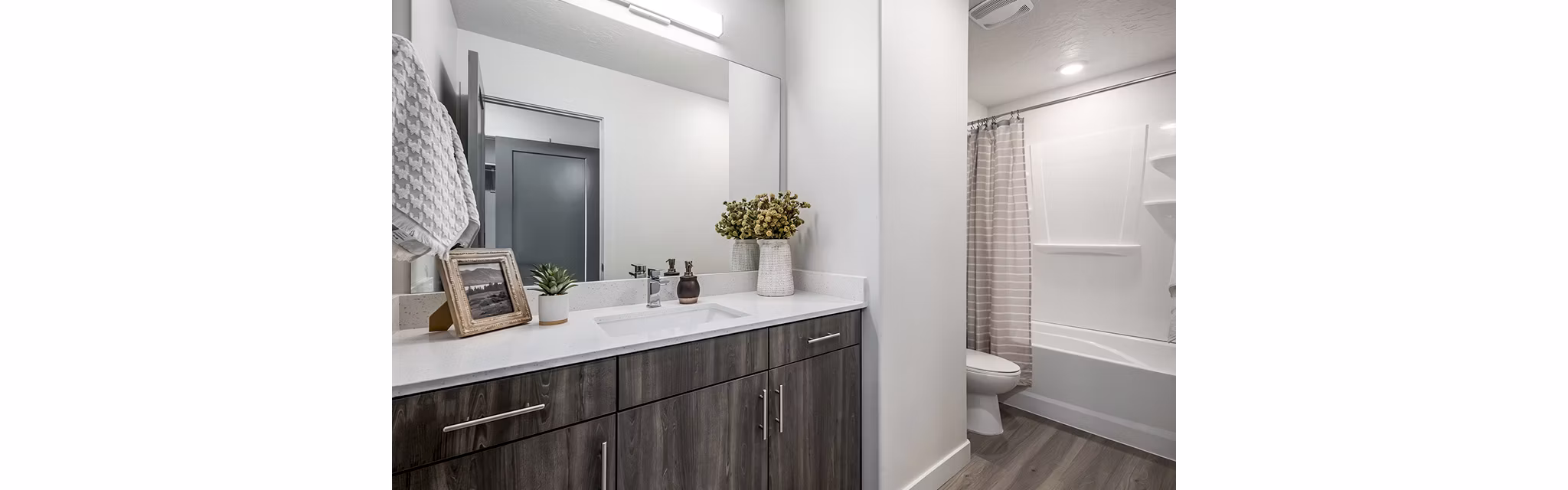 Banner Hill Apartments: Modern bathroom with sleek fixtures and marble countertop