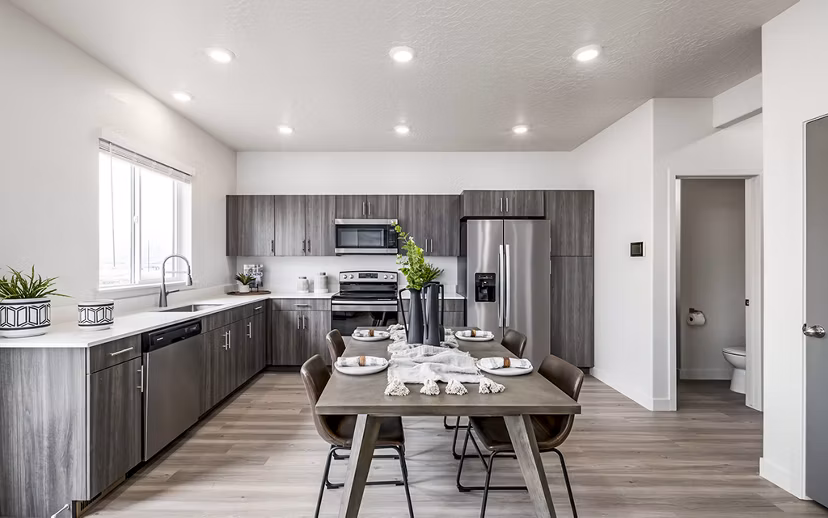 Dining room featuring contemporary design and elegant lighting at Banner Hill Apartments