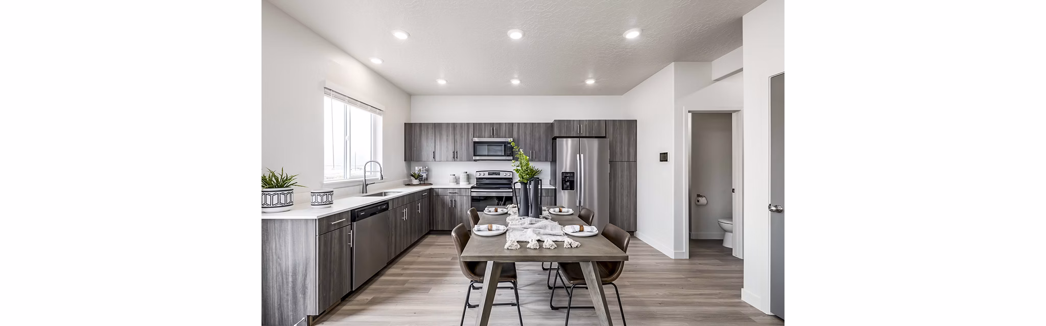 Dining room featuring contemporary design and elegant lighting at Banner Hill Apartments