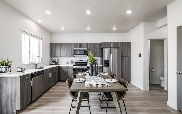 Dining room featuring contemporary design and elegant lighting at Banner Hill Apartments