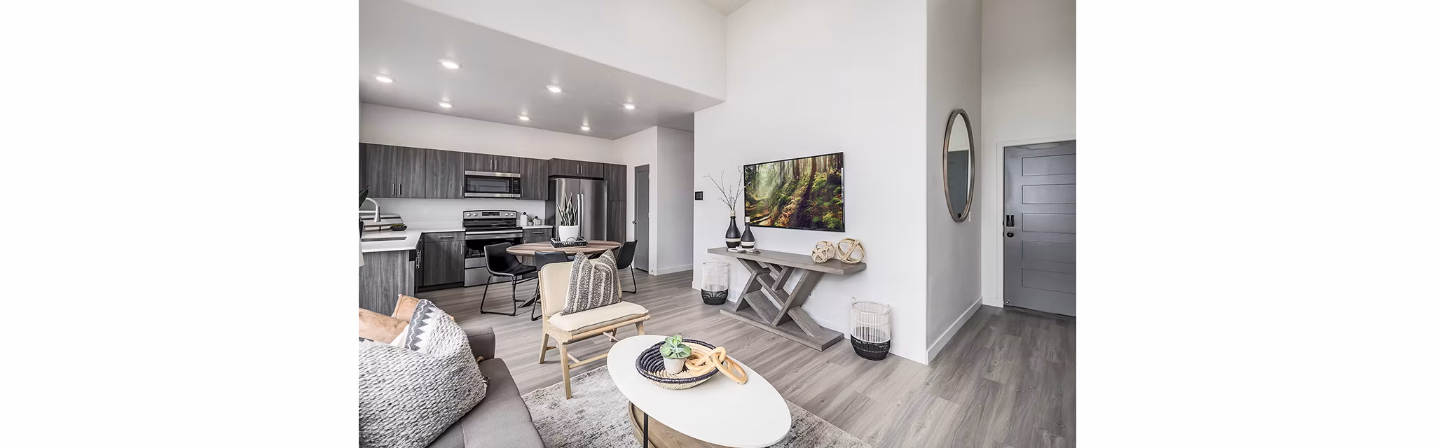 Modern living room with cozy seating and sleek decor at Banner Hill Apartments