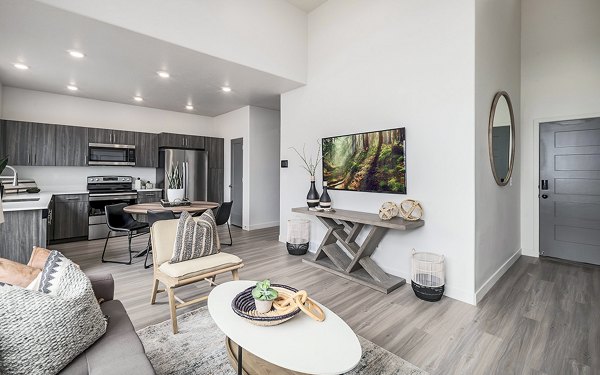 Modern living room with cozy seating and sleek decor at Banner Hill Apartments