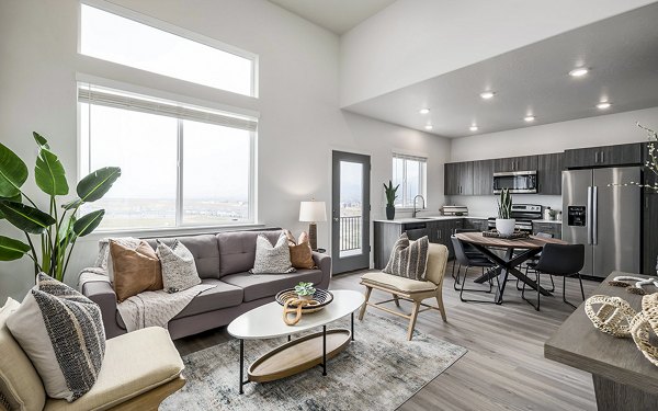 Spacious living room with modern decor at Banner Hill Apartments, featuring premium flooring and large windows for natural light