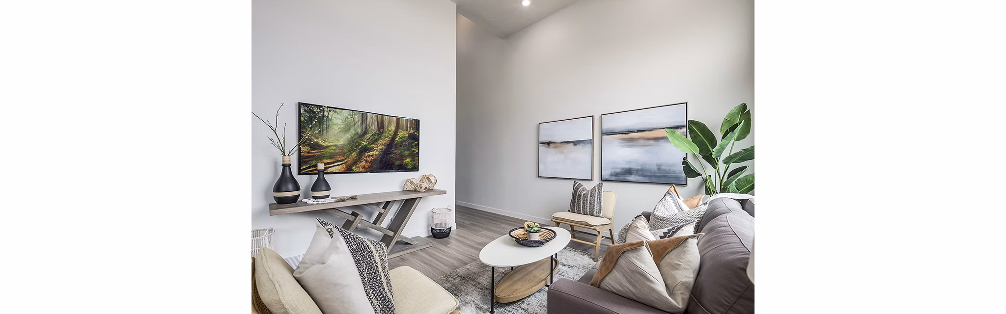 Contemporary living room with stylish decor at Banner Hill Apartments, featuring urban views and modern furnishings