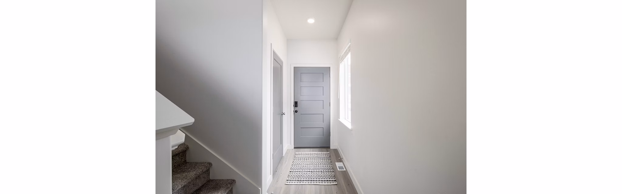 Contemporary hallway with sleek lighting fixtures at Banner Hill Apartments in downtown Baltimore