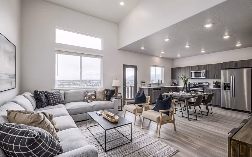 Elegant living room with modern decor and large windows at Banner Hill Apartments