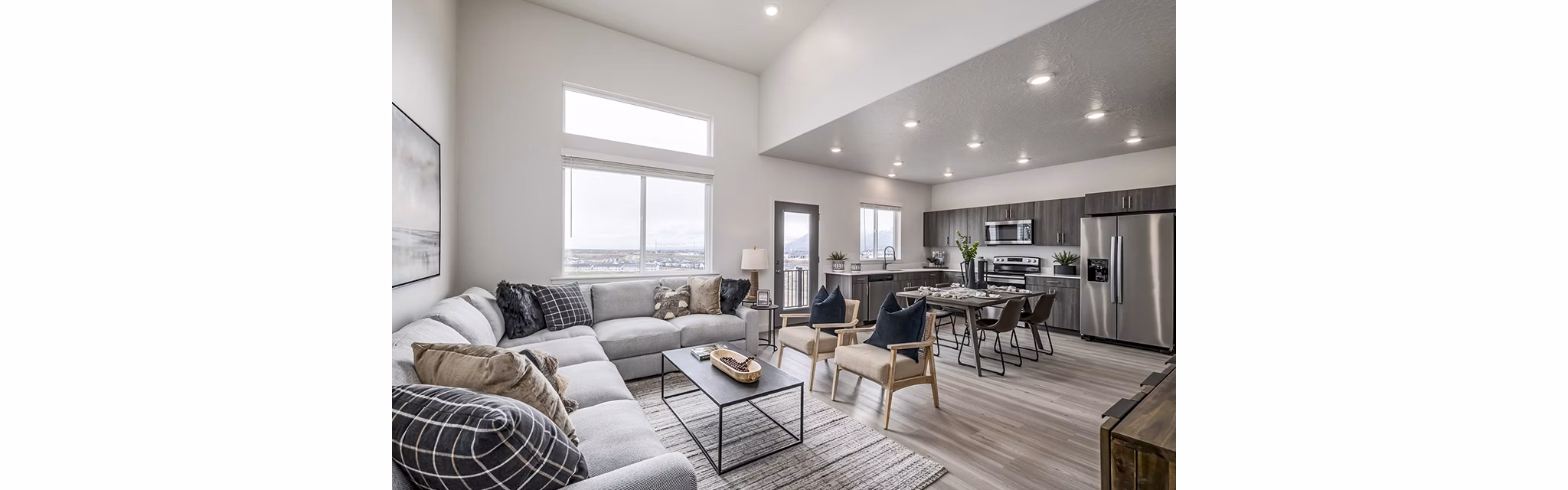 Elegant living room with modern decor and large windows at Banner Hill Apartments