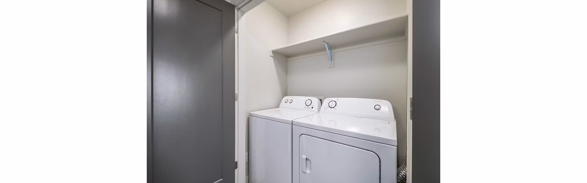 Laundry room featuring state-of-the-art appliances at Banner Hill Apartments