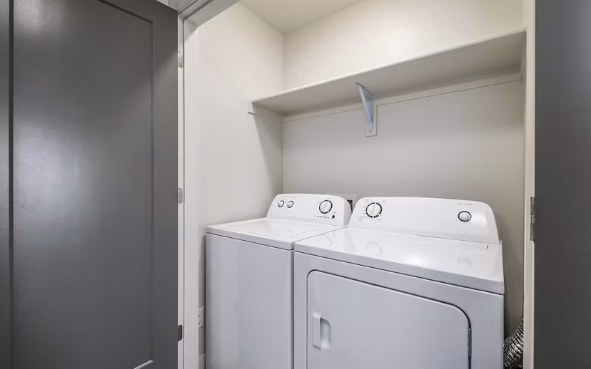 Laundry room featuring state-of-the-art appliances at Banner Hill Apartments
