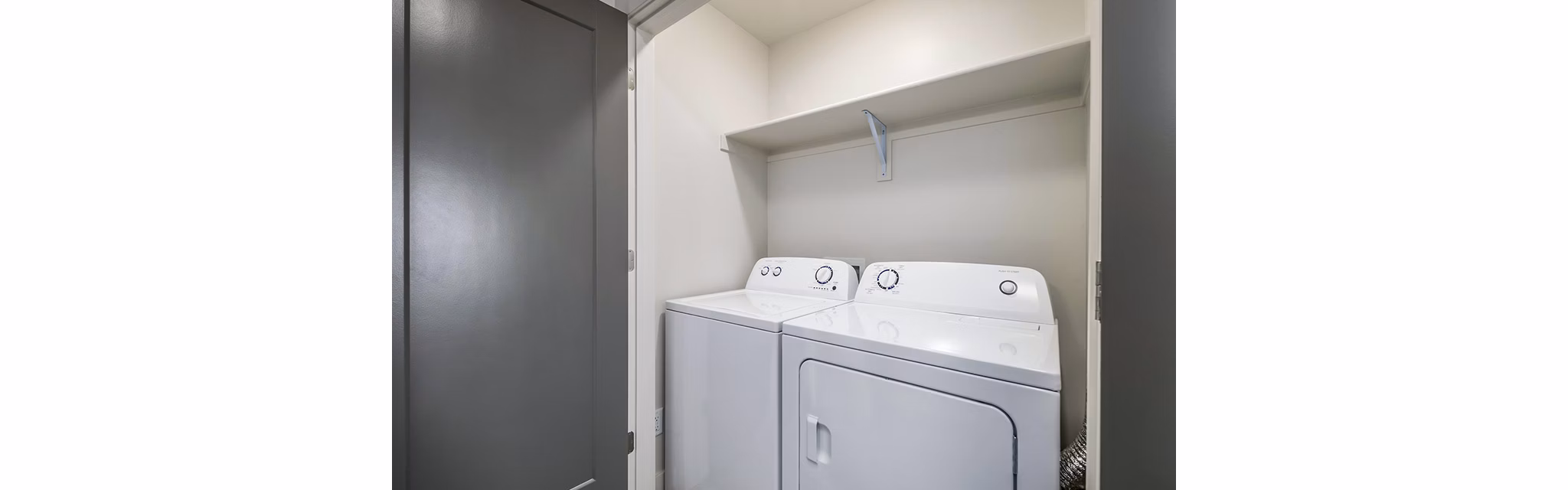 Laundry room featuring state-of-the-art appliances at Banner Hill Apartments