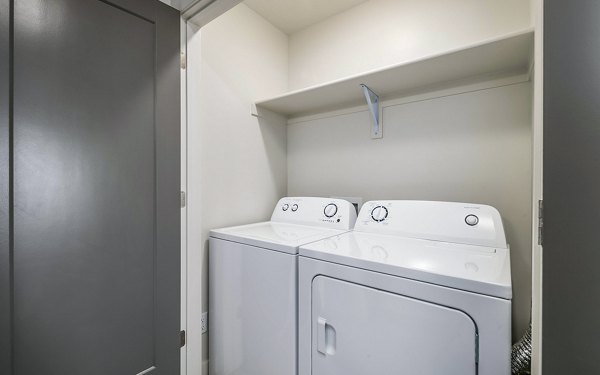 Laundry room featuring state-of-the-art appliances at Banner Hill Apartments