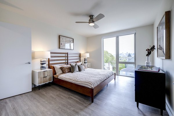 Bedroom featuring modern decor and plush bedding at Broadstone Vin Apartments
