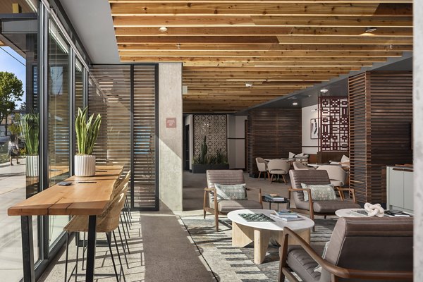 Elegant clubhouse featuring modern decor and spacious seating at Broadstone Vin Apartments, perfect for social gatherings and relaxation