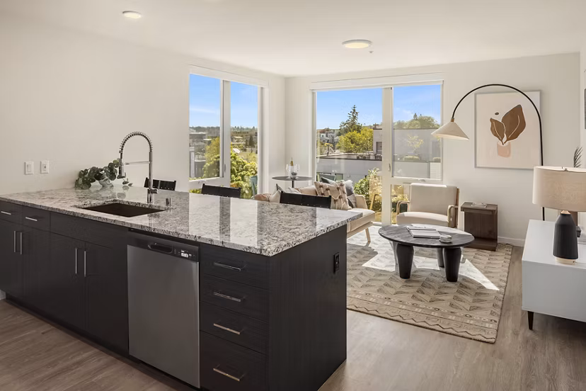 Modern kitchen with stainless steel appliances and granite countertops in Broadstone Vin Apartments