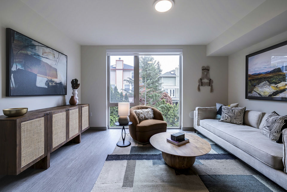 Stylish living room with modern decor and large windows in Broadstone Vin Apartments