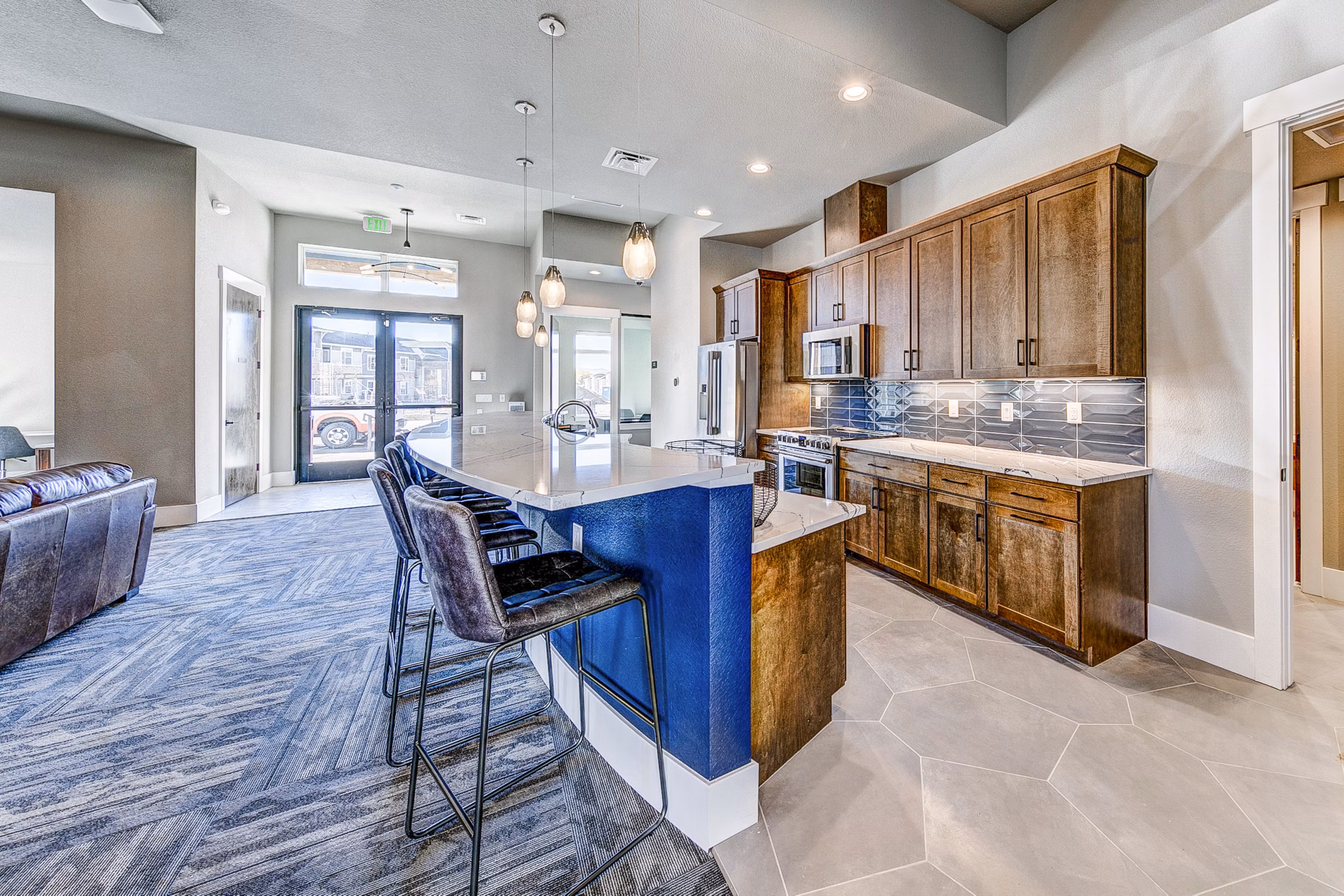 Clubhouse with modern seating and decor at The Bend at Highland Meadows Apartments