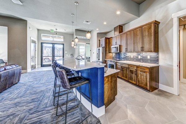 Clubhouse with modern seating and decor at The Bend at Highland Meadows Apartments