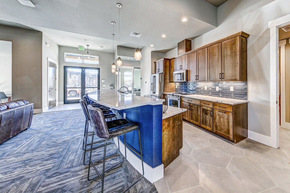 Clubhouse with modern seating and decor at The Bend at Highland Meadows Apartments