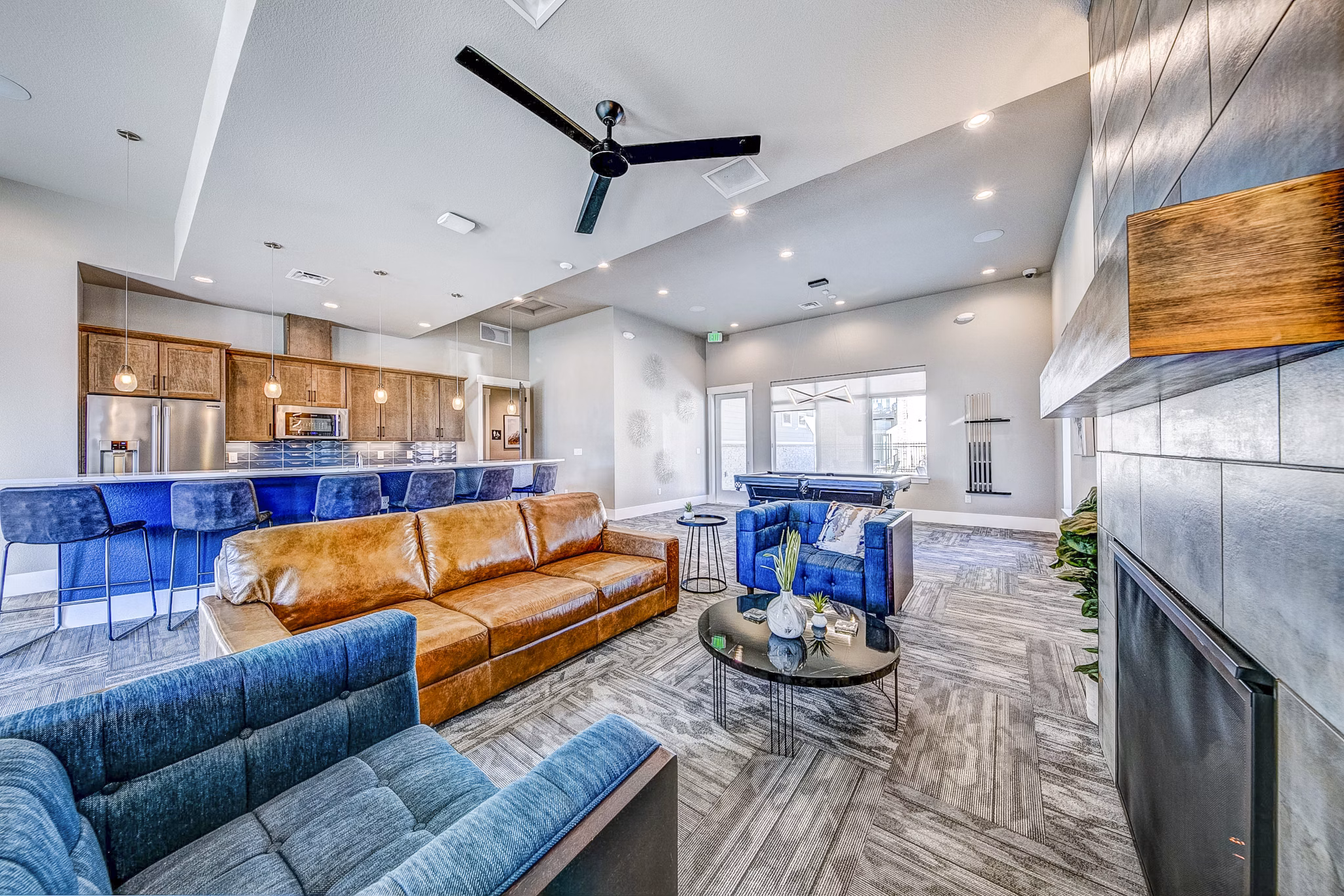 Elegant clubhouse lobby with plush seating and modern decor at The Bend at Highland Meadows Apartments