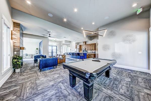 clubhouse game room at The Bend at Highland Meadows Apartments