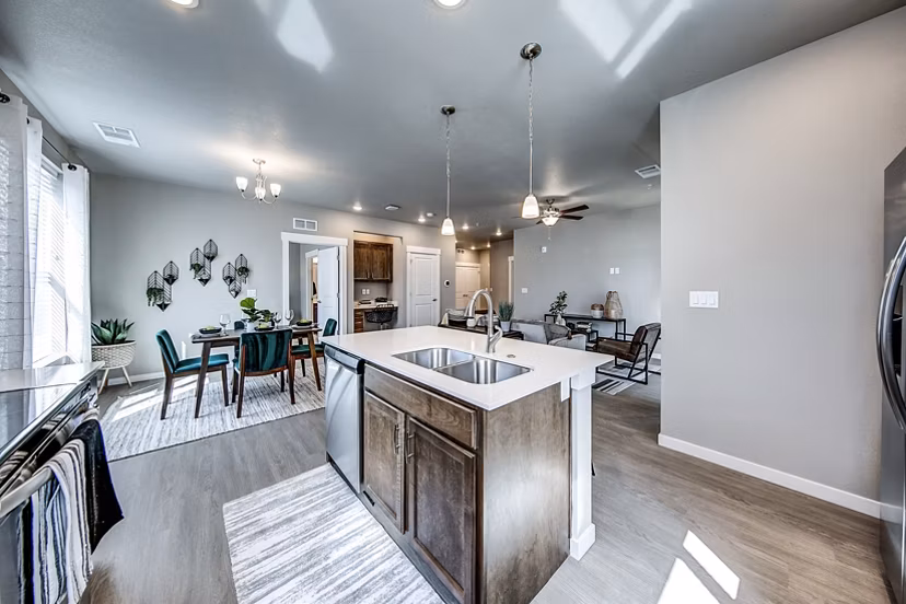 Spacious kitchen featuring modern appliances at The Bend at Highland Meadows Apartments
