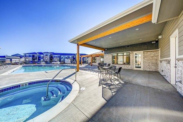 The Bend at Highland Meadows: Resort-style pool with sun loungers at luxury apartments