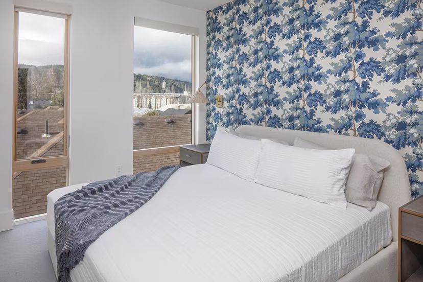 Modern master bedroom featuring elegant decor at The Fitz Apartments
