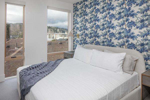 Modern master bedroom featuring elegant decor at The Fitz Apartments