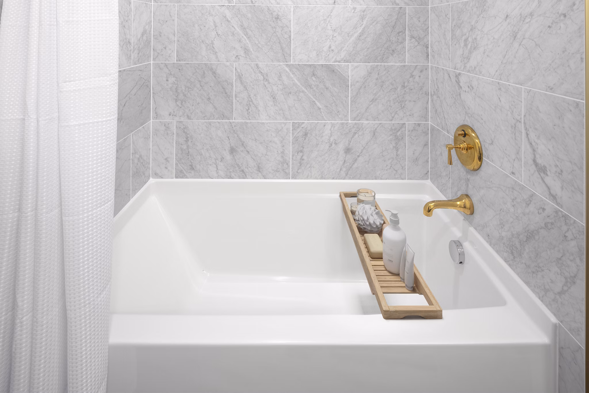 Modern bathroom featuring dual sinks and sleek fixtures at The Fitz Apartments